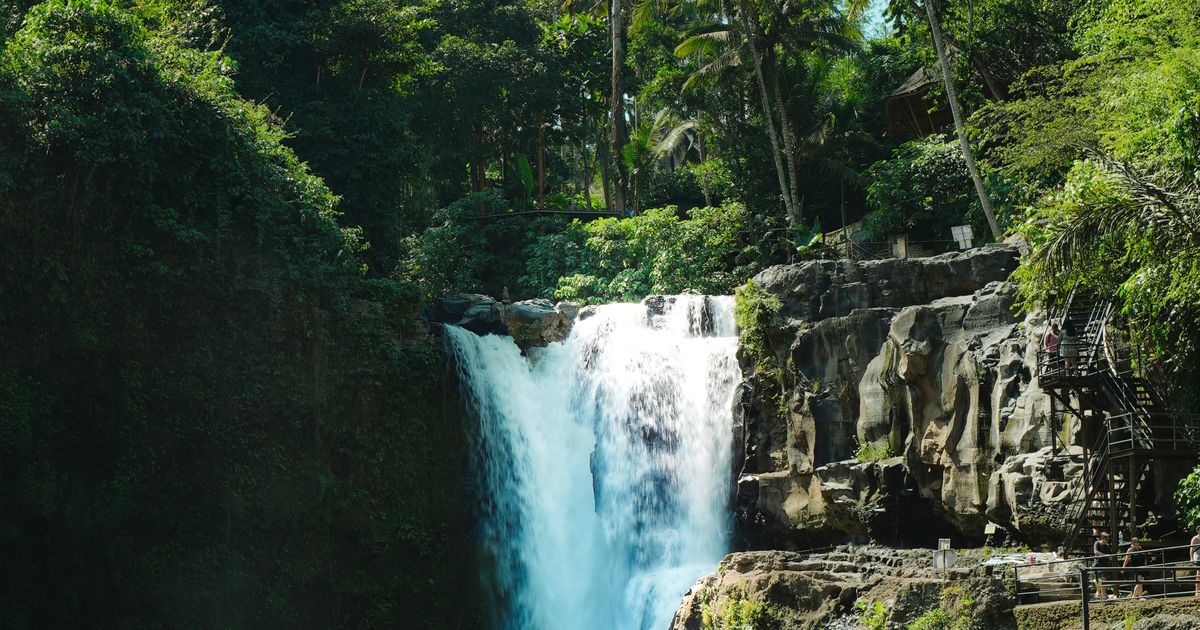 Tegenungan Waterfall amidst lush jungle greenery, Bali